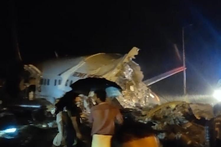 air india, air india crash, calicut, kerela, Kerala plane accident: Air India plane breaks in two at Calicut runway, global news, world news, Kozhikode, Air India plane crash: Kerala plane accident at Calicut runway. air india, air india crash, calicut, kerela, Kerala plane accident: Air India plane breaks in two at Calicut runway, global news, world news, Kozhikode, Air India plane crash: Kerala plane accident at Calicut runway.