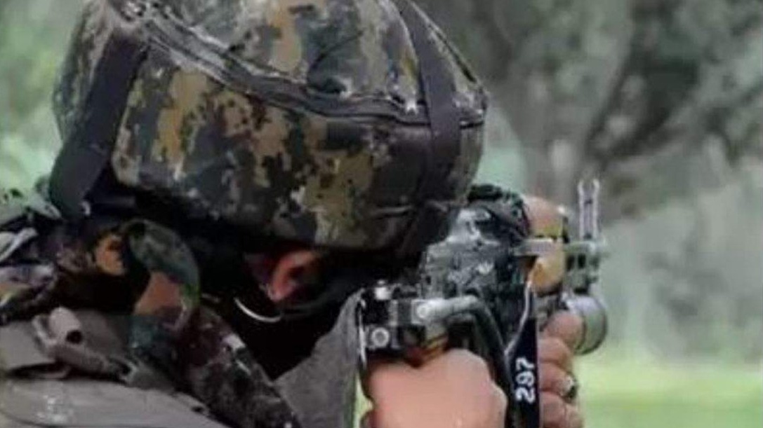 Image of a military personnel shooting down the terrorists.