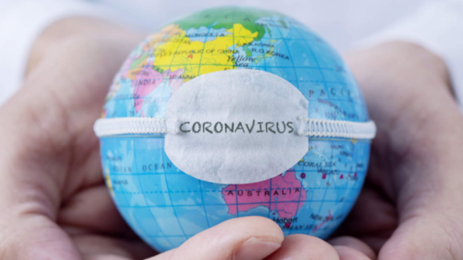 Image of a world gripped in the hands of coronavirus.
