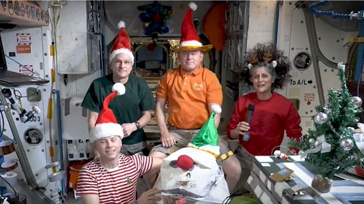 International Space Station,  Christmas greetings,  astronauts in space,  ISS crew,  festive season in orbit,  space exploration,  Sunita Williams,  Barry Wilmore,  holiday celebration in space,  Christmas message from space