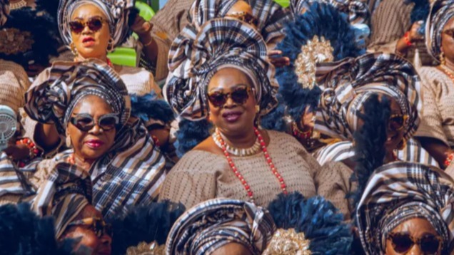 Nigerian king,  cultural celebration,  traditional attire,  agbada,  gele,  coral beads,  talking drums,  oriki,  royal regalia,  Nigerian traditions